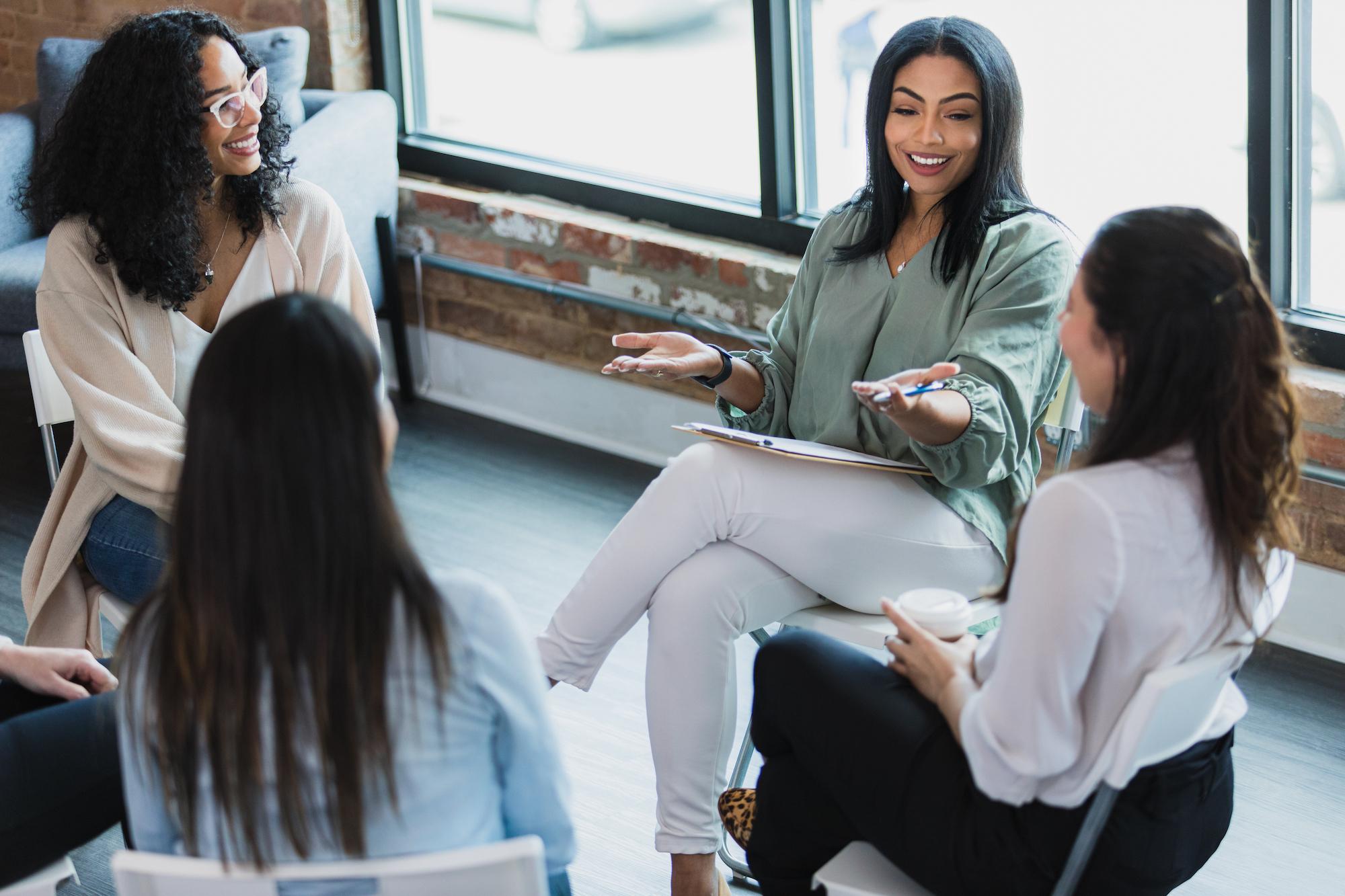 woman leading a group meeting in circle