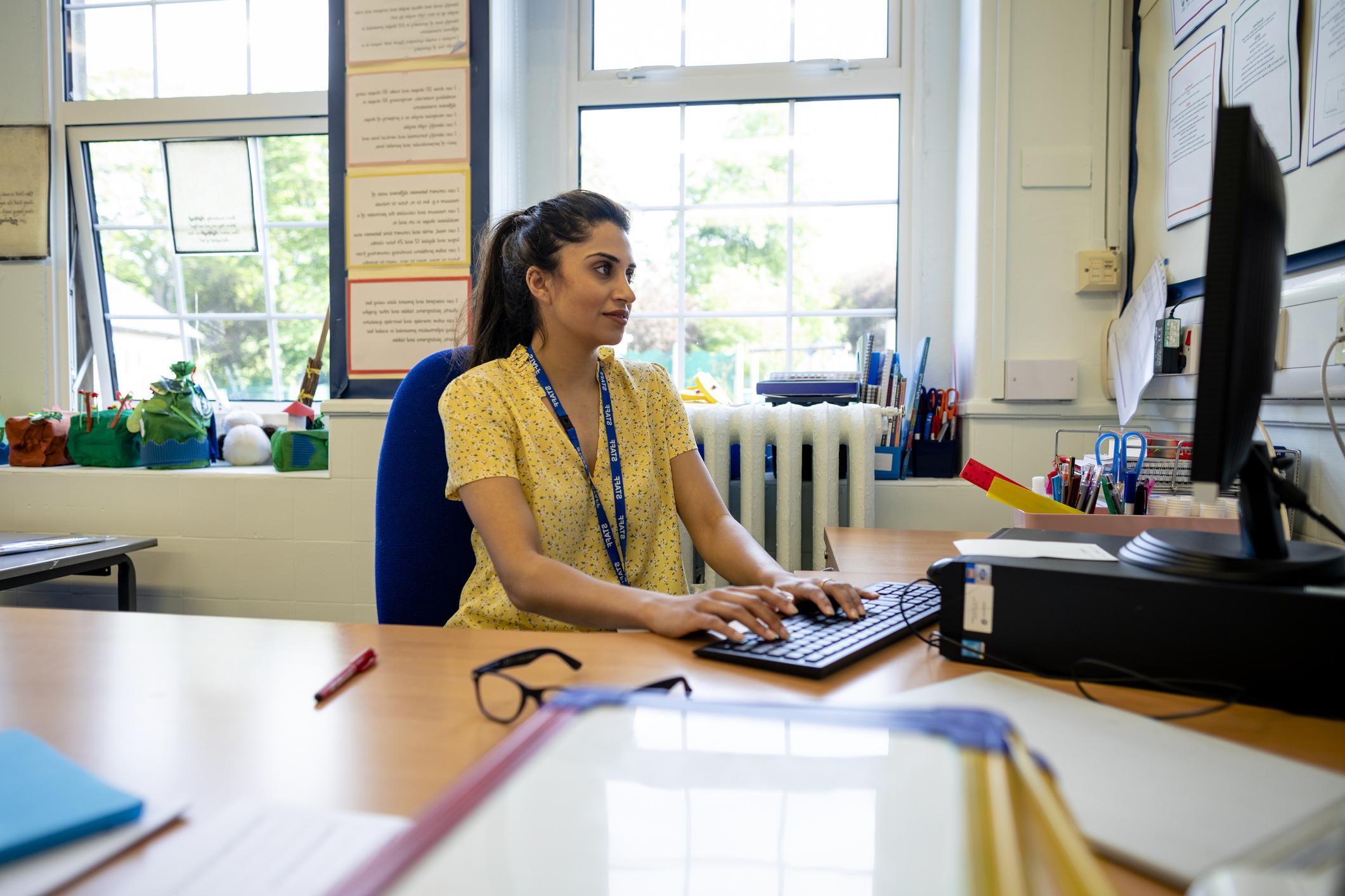 teacher at computer