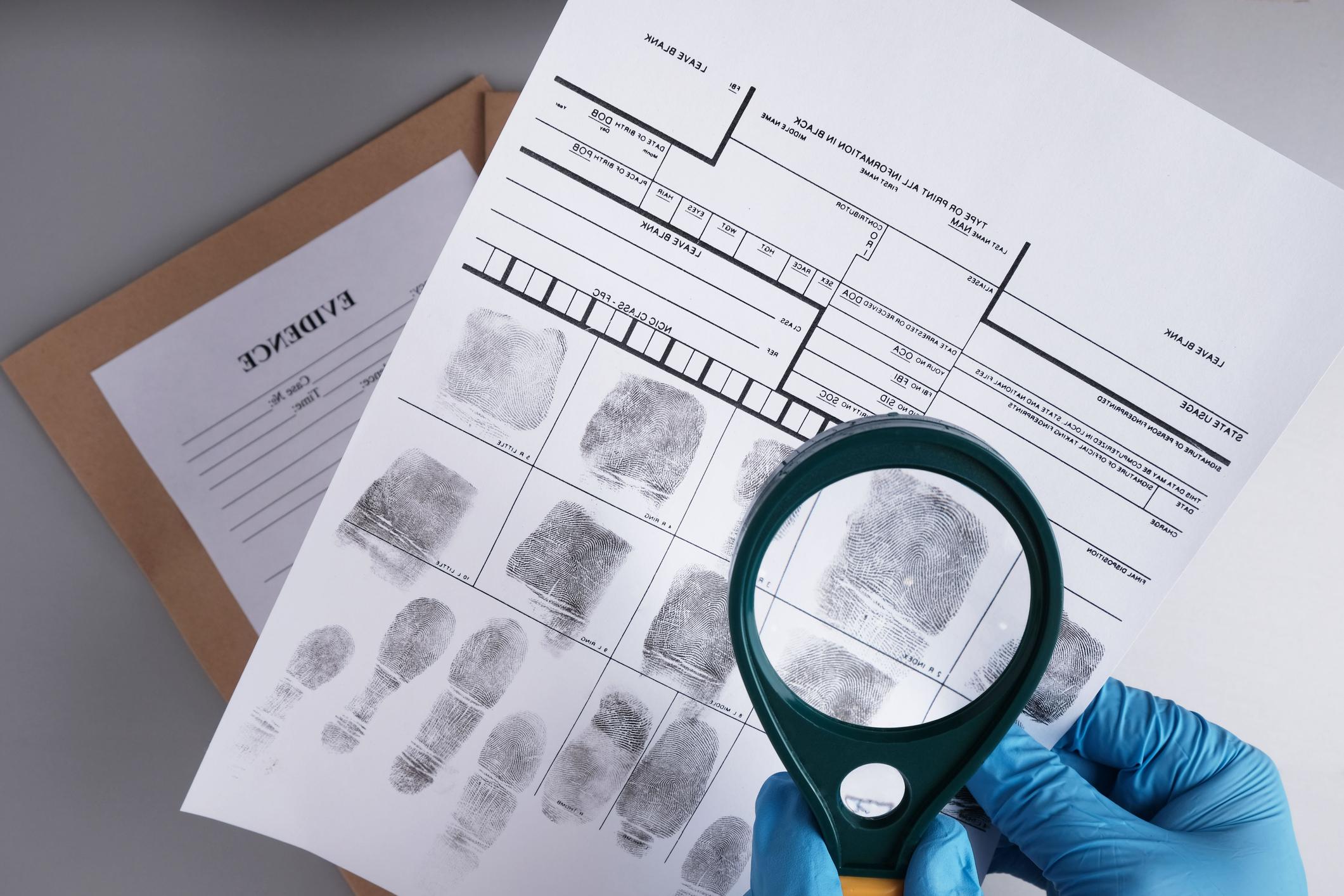 magnifying glass viewing fingerprints