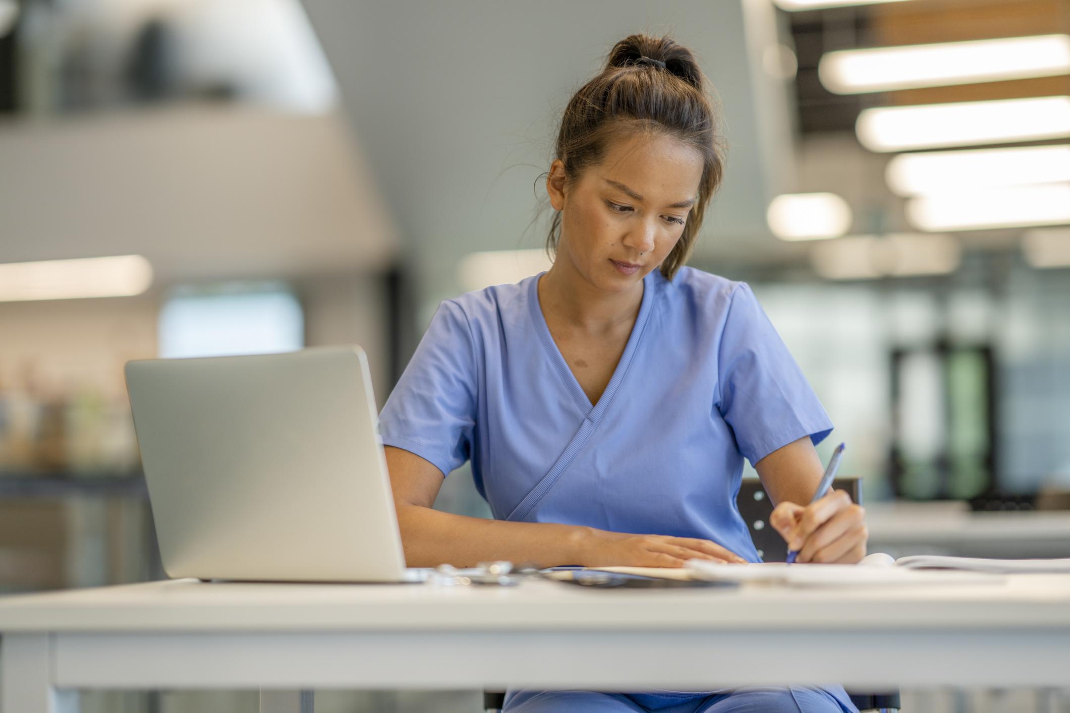 nurse studying at a desk