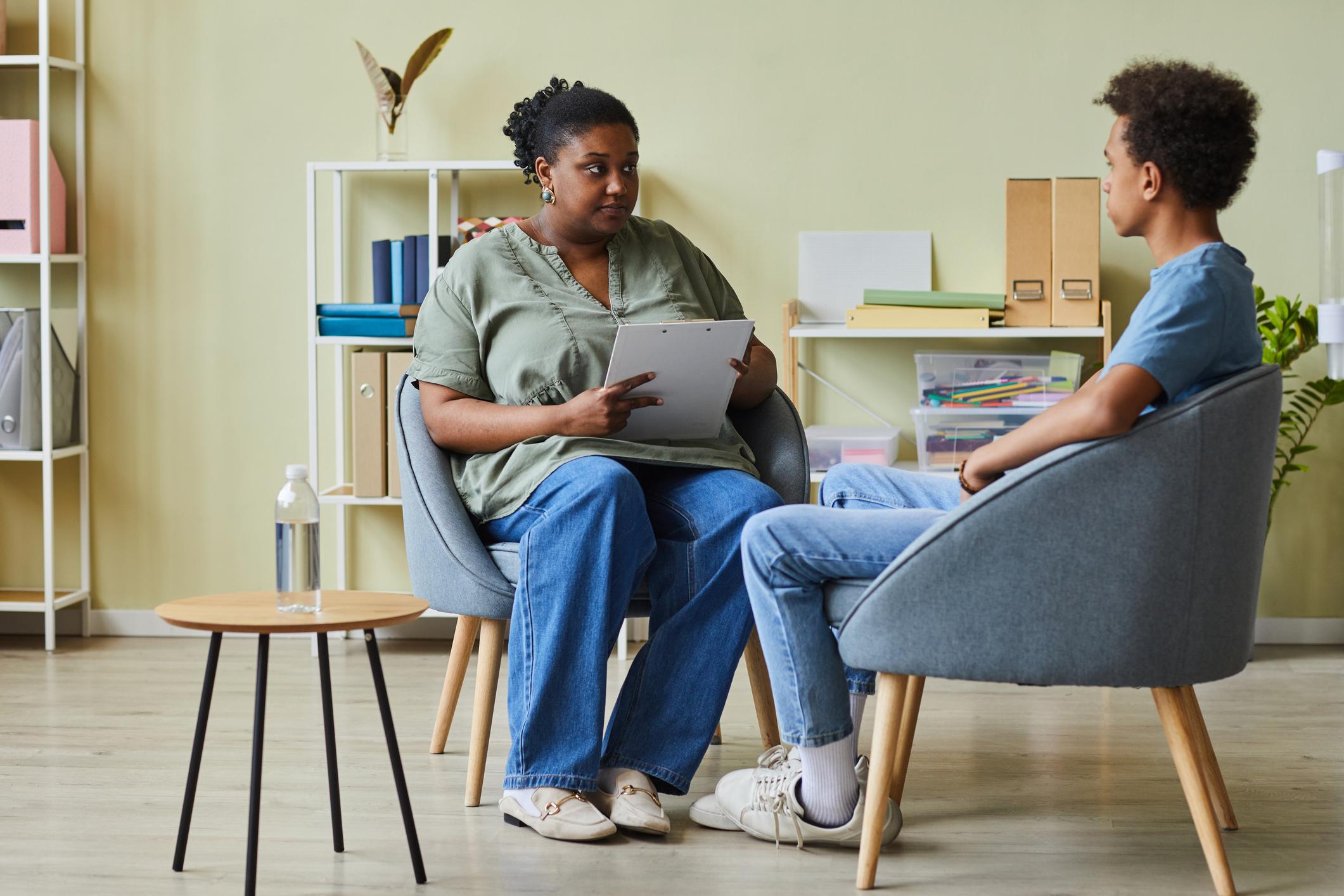 social worker talking to younger man